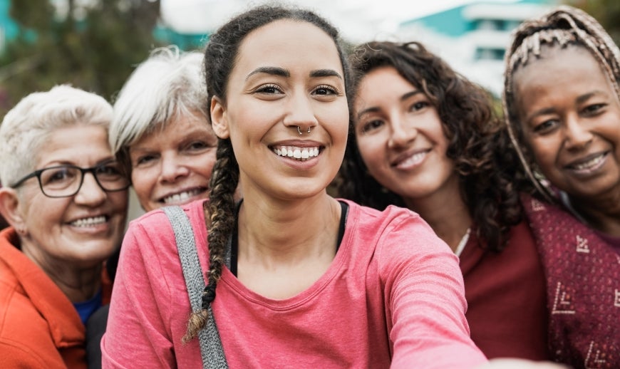 five women taking a photo together