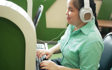 woman sitting in front of computer