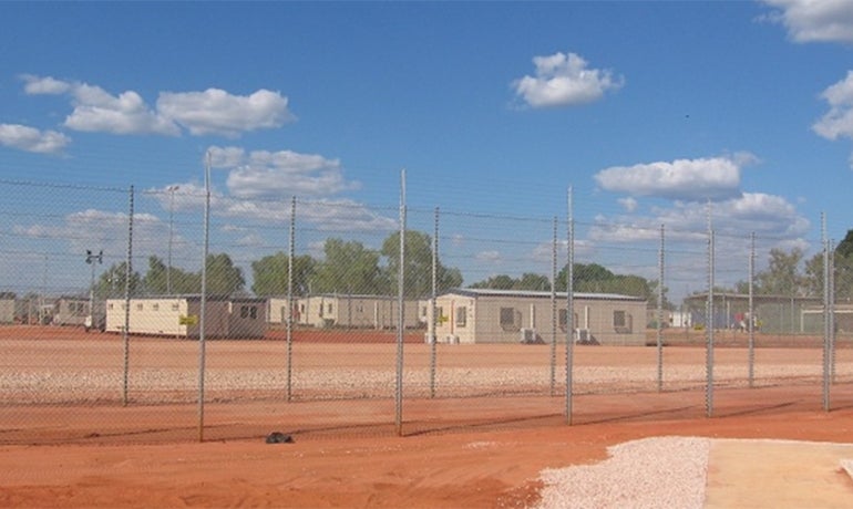 Immigration_detention2016_870x500.jpg Immigration detention centre in dusty field