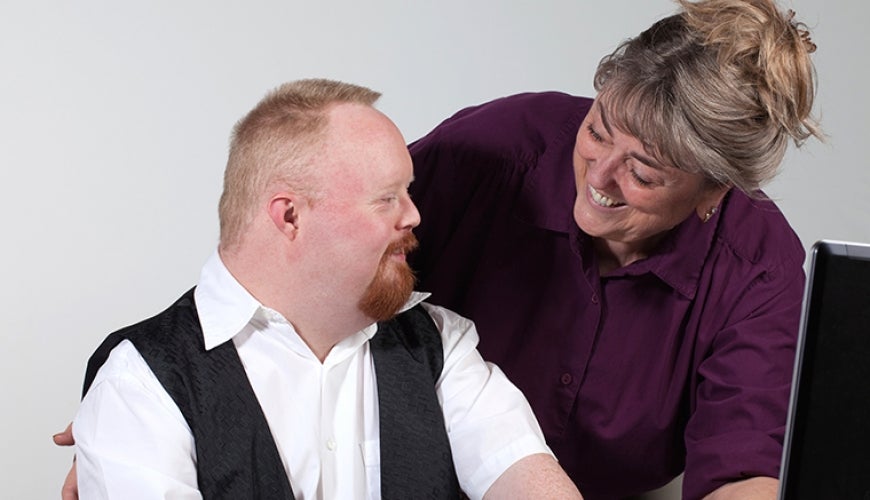 iStock_000014095218_Double.jpg Worker with Down Syndrome and co-worker. Image from iStock.